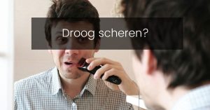 Man scheert zich droog met een elektrisch scheerapparaat